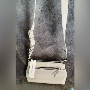 Calvin Klein Light Gray Crossbody Bag with adjustable comfort strap